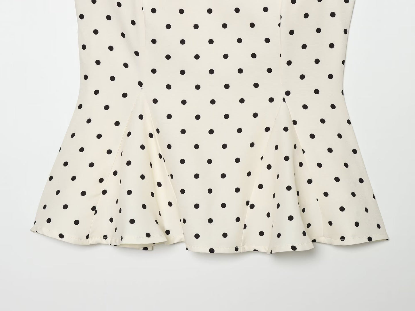 Women's ruffled hem polka dot sleeveless top