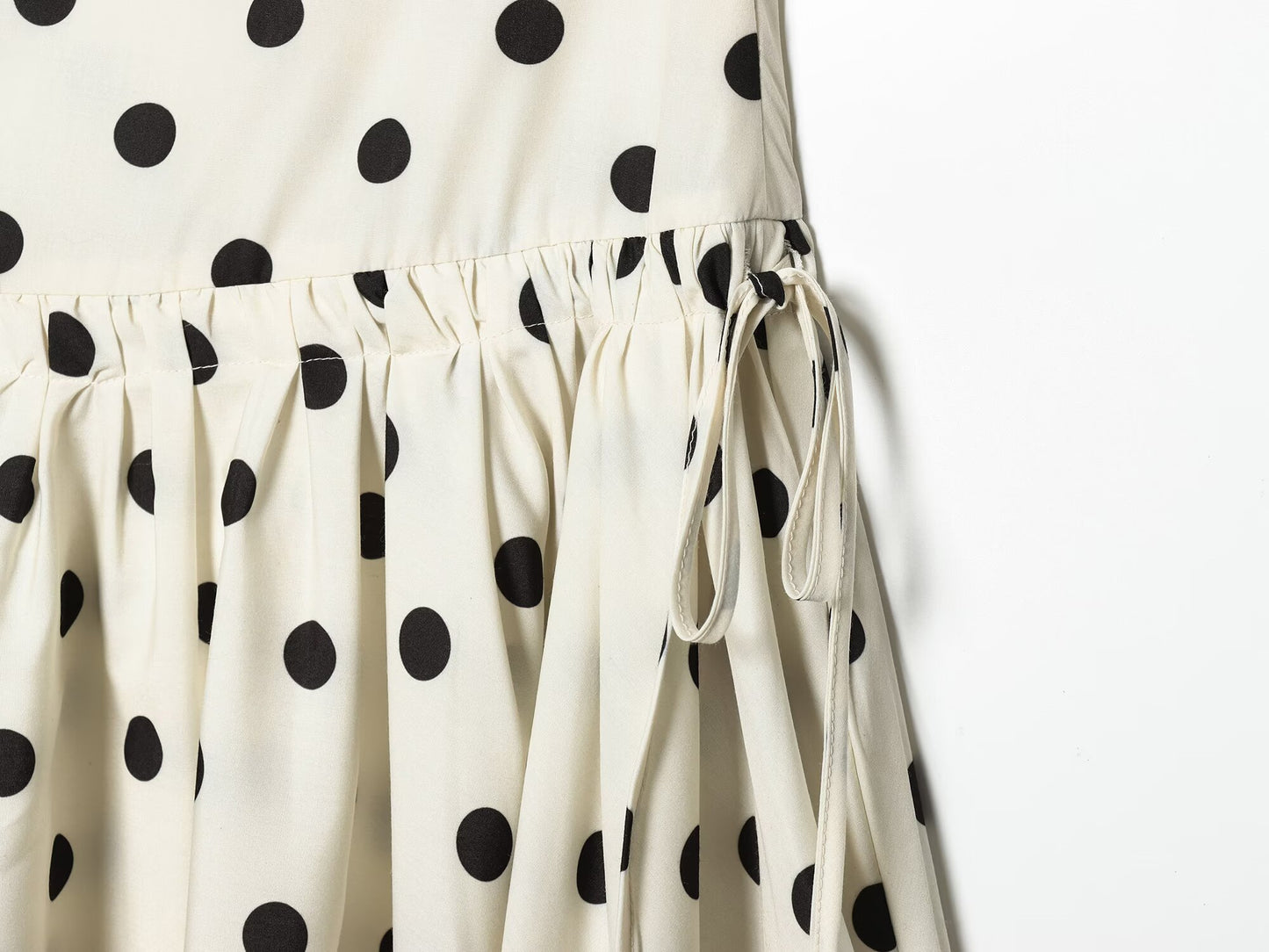 Women's asymmetrical polka dot MIDI skirt